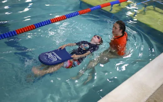 a couple of women in a pool