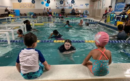 a group of people in a pool