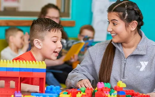 a person and a child playing with toys