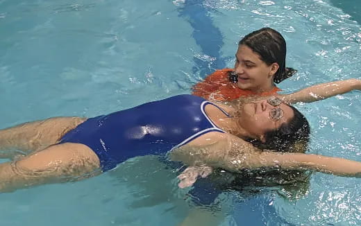 a woman and a man in a pool