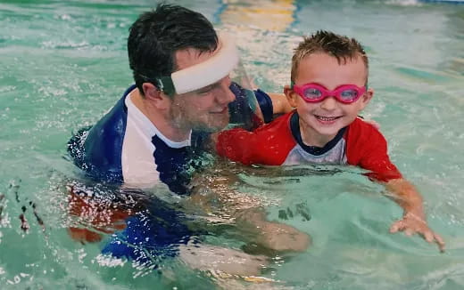 a man and a boy in the water