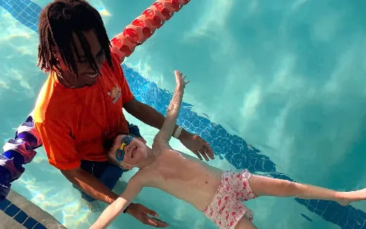a man and woman in a pool