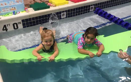 a group of children in a pool