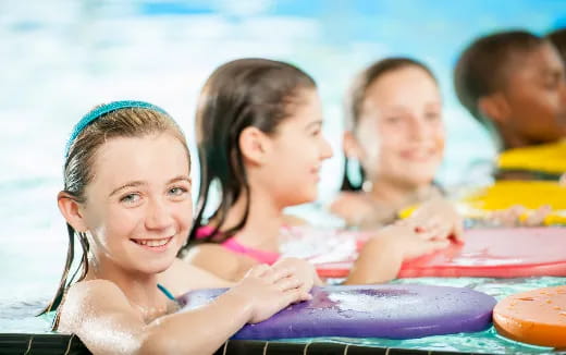 a group of children in a pool