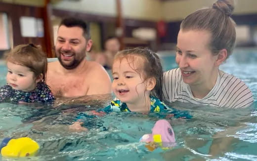 a group of people in a pool