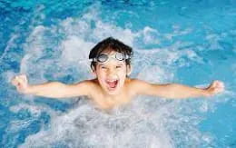 a man swimming in a pool