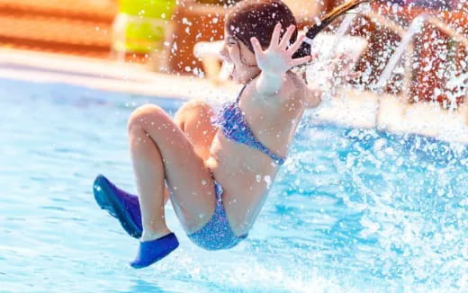 a person in a swimsuit in a pool