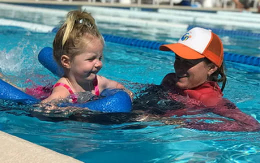 a couple of girls in a pool