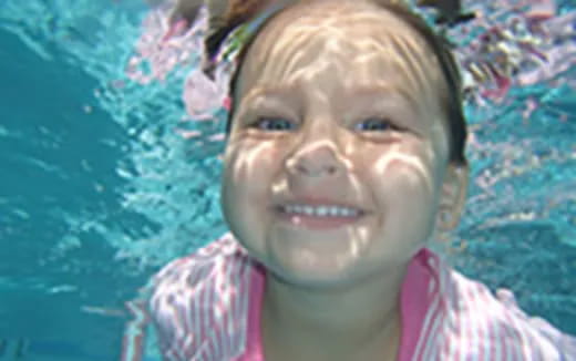 a child smiling for the camera