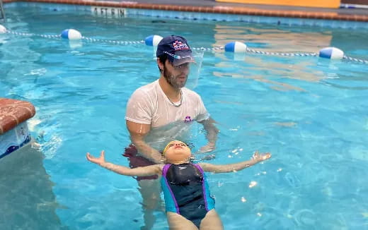 a man and a woman in a pool