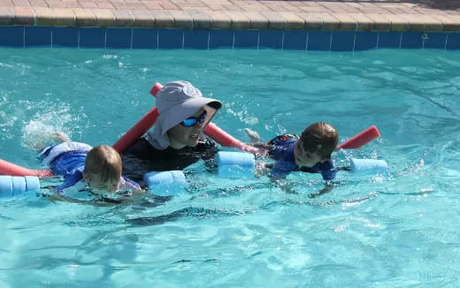 a group of people in a pool