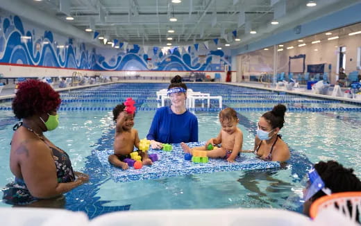 a group of people in a pool