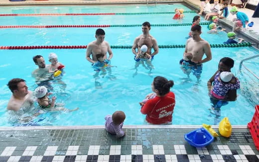 a group of people in a pool
