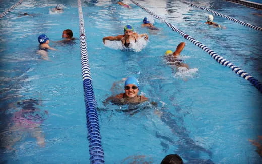 a group of people in a pool