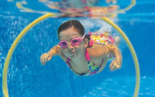 a baby in a pool