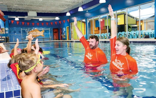 a group of people in a pool