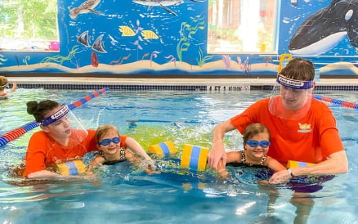 a group of people in a pool