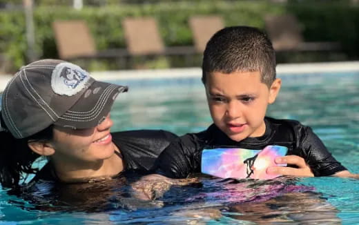 a couple of boys in a pool