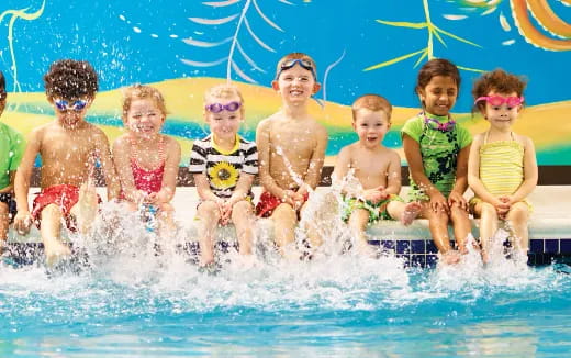 a group of kids in a pool