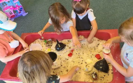 children playing with a board game