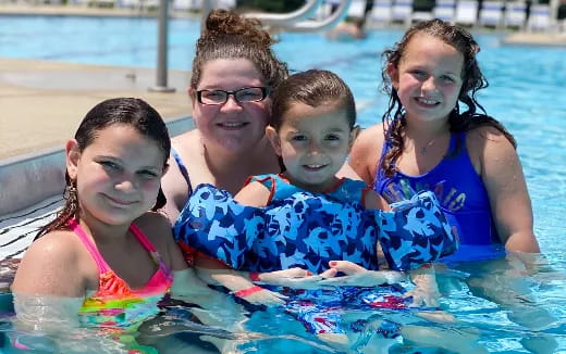 a group of people in a pool