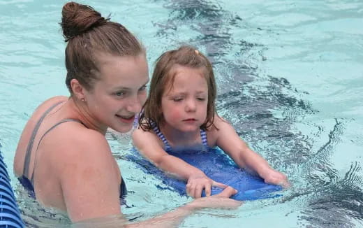 a woman and a girl in the water