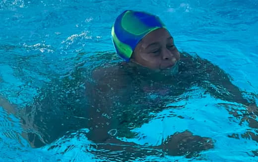 a person swimming in a pool