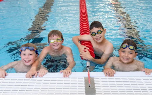 a group of kids in a pool