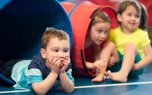 a group of children sitting on the floor
