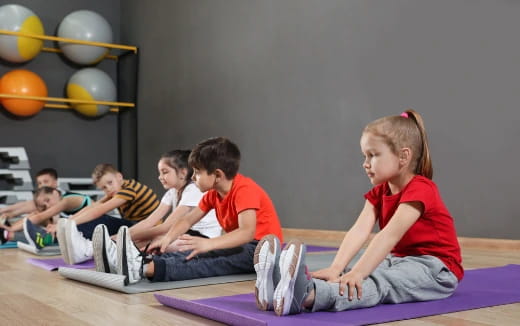 a group of children sitting on the floor