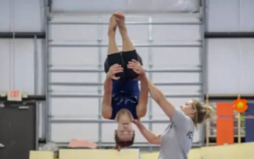 a woman doing a high jump
