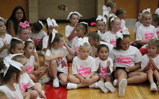 a group of children sitting on the floor