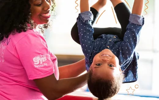 a woman doing a plank on a man's head