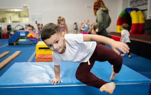 a boy doing a yoga pose