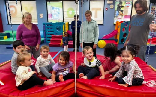 a group of children sitting on the floor