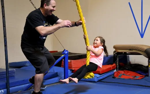 a man and a girl exercising