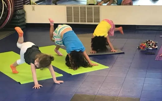 a group of people doing yoga