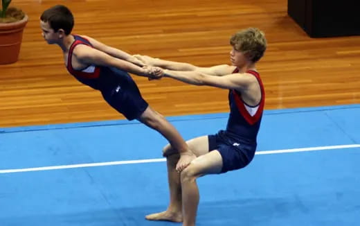 a couple of boys in a gym