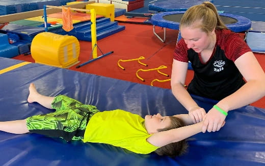 a person and a child on a mat