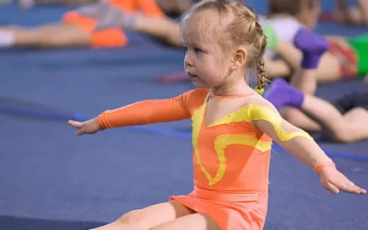 a girl in an orange outfit