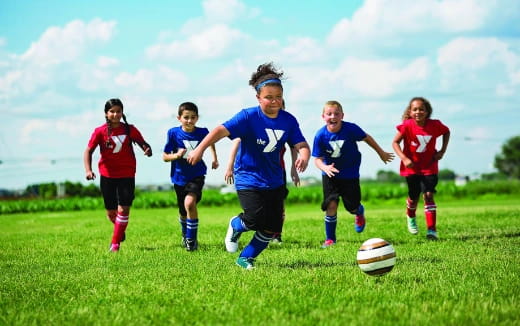 a group of girls playing football