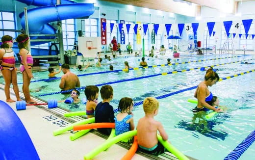 a group of people in a swimming pool
