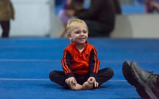 a child sitting on the ground