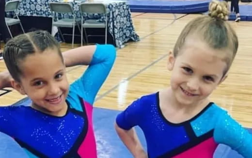 a couple of girls in blue shirts