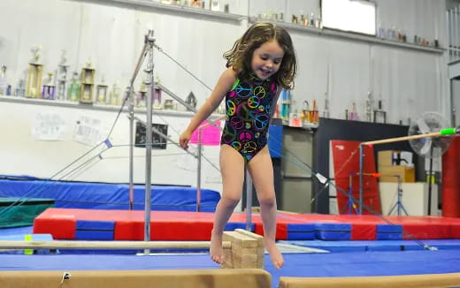 a girl jumping on a trampoline