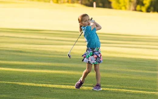 a girl holding a bow and arrow