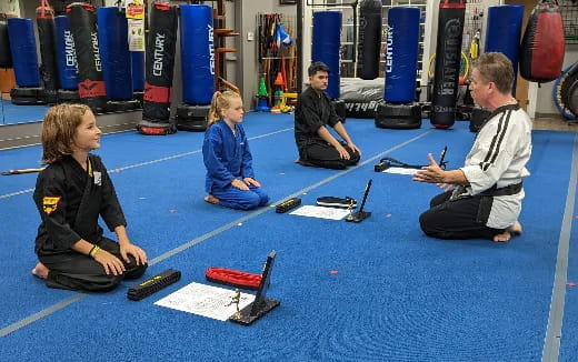 a group of people sitting on the floor