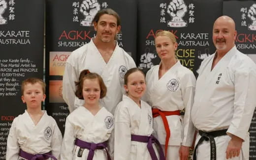 a group of people wearing white shirts