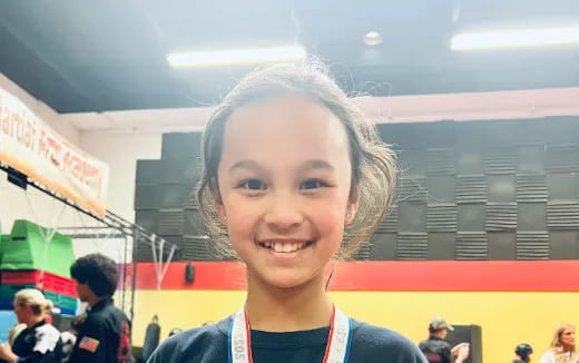 a girl smiling for the camera