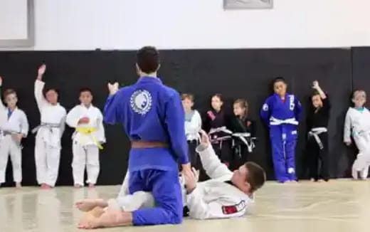 a group of people in karate uniforms